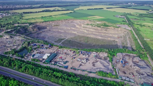 Opencast Granite Mining Quarry with Working Machinery alt