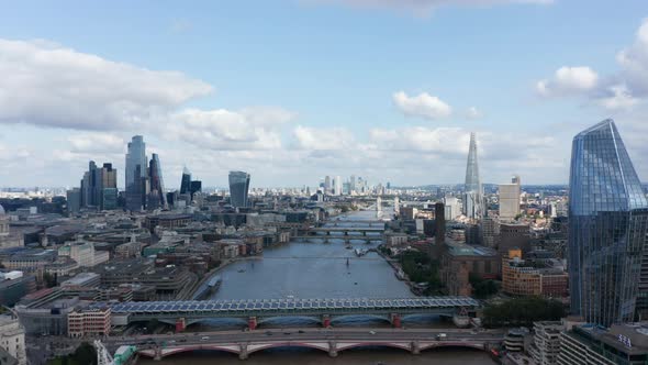 Aerial View of Modern Downtown Skyscrapers Mixed with Traditional Buildings Along Thames River