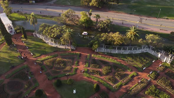 Pergola bridge and white boat on lake in Rosedal or rose garden, Tres de Febrero Park at Buenos Aire