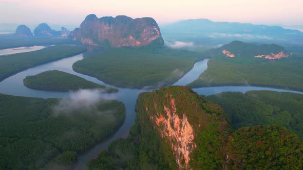 4K : Drone flying above the clouds, Limestone mountains with mangrove