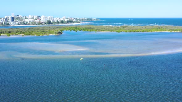 Aerial view of kitesurfing on a hydrofoil board, Queensland, Australia.