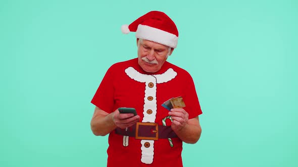 Christmas Grandfather Using Credit Bank Card Smartphone While Transferring Money Shopping Online