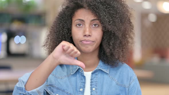 Thumbs Down By Disappointed African Woman