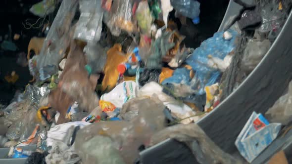 Lots of Household Trash Is Sorted for Recycling at a Plant. .