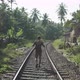 Traveler Goes on Rail Tracks - VideoHive Item for Sale