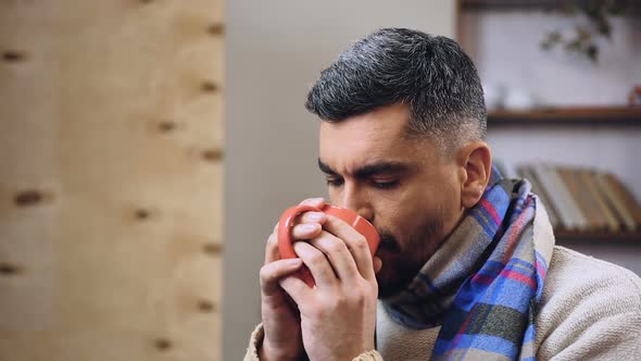 Feeble Diseased Male Drinking Hot Tea With Medicine to Remove Influenza Symptoms