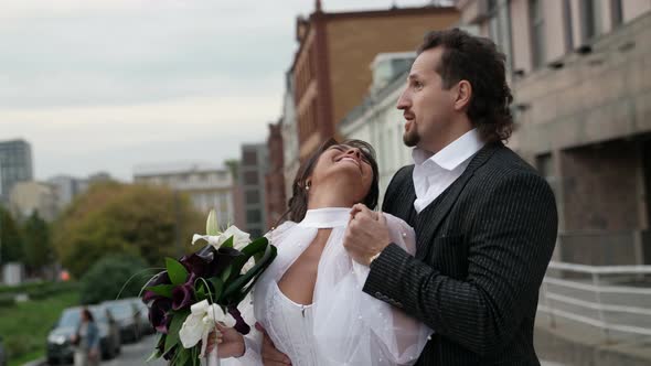 Emotion of Just Married Couple Happy Bride and Groom on City Street Wedding Day