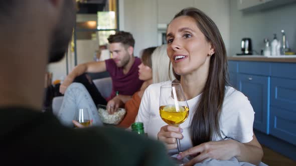 Young adult woman flirting with man during the house party. Shot with RED helium camera in 8K