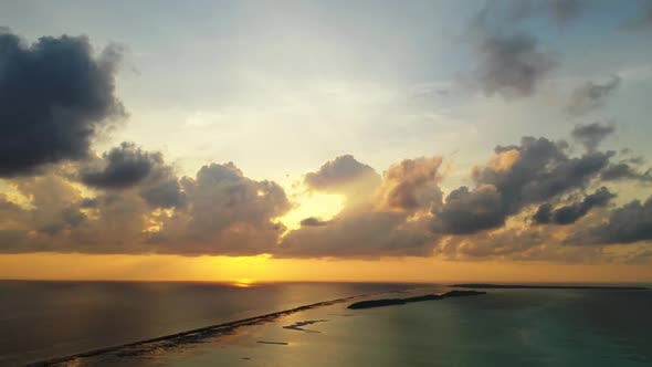 Aerial drone view nature of tranquil seashore beach journey by blue lagoon and white sandy backgroun