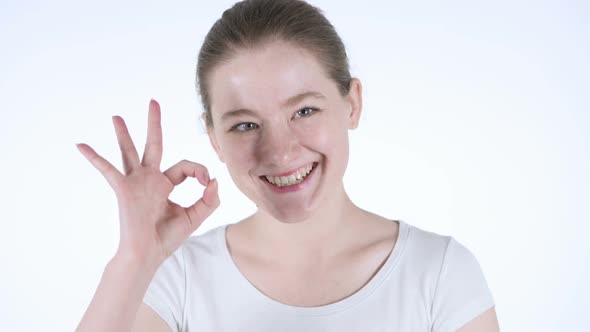 Okay Sign By Young Redhead Woman