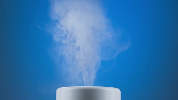 White Humidifier at Blue Background