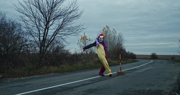 A Scary Clown Is Dancing On The Road