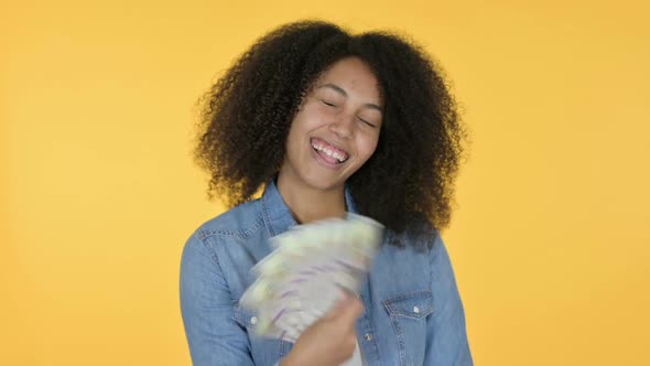 African Woman Holding Dollars Yellow Background