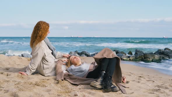 Beautiful Girls Walk Near the Sea