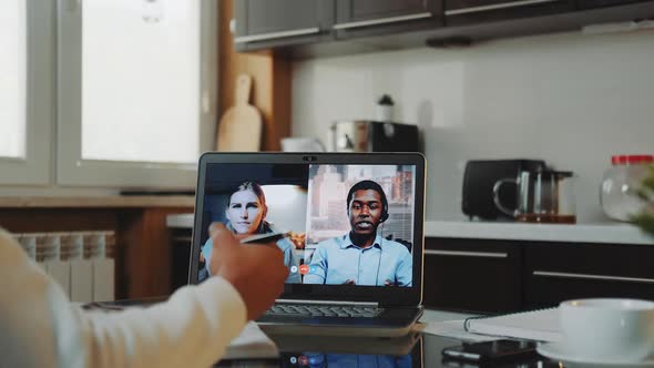 Closeup Shot of Multiracial Colleagues Working Home on Quarantine By Making Common Video Call By