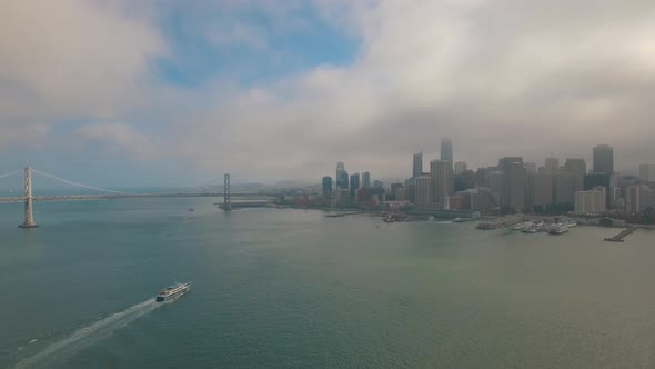 San Francisco Skyline Aerial with Tourist Boat and Blue Sky 4K