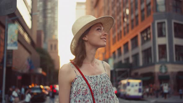 Beautiful girl with a retro camera in Manhattan, NYC