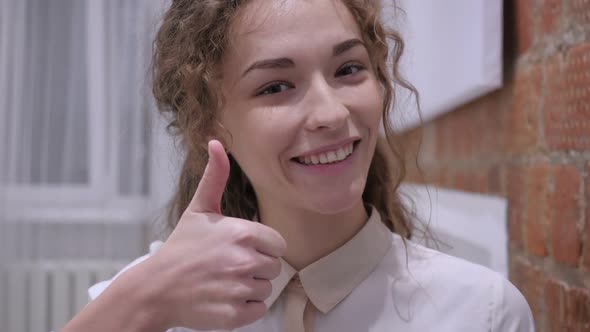 Thumbs Up By Young Female Positive Gesture at Home