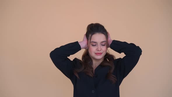 Young Business Woman in Black Jacket Covering Her Ears and Does Not Want to Listen Anything Over