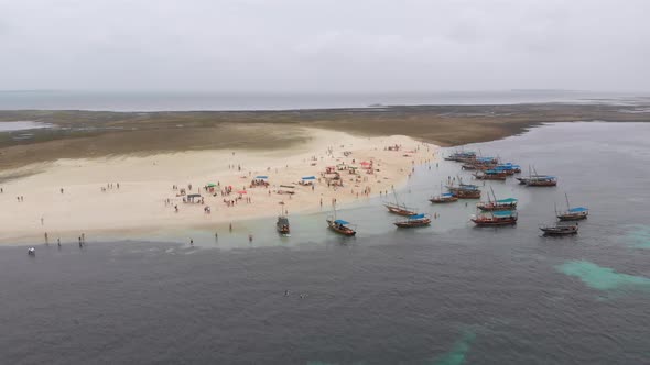 Aerial View Disappearing Island with Tourists and Boats in Menai Bay Zanzibar