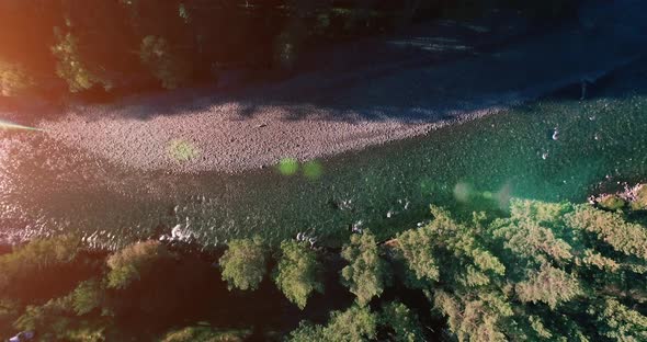 Mid Air Flight Over Fresh and Clean Mountain River at Sunny Summer Morning. Vertical Movement