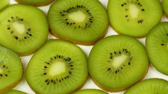 Top view Rotate of Transparent Slice of kiwi fruit on white background, Close up fresh kiwi