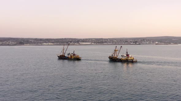 Fishing Trawlers at Sea in the Early Morning Aerial View