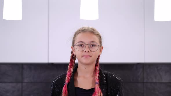 Girl in Shiny Jacket Plays Putting on Stylish Headband Close