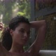 A girl in a bathtub in a forest during the rain. Beautiful young woman relaxing in the bathroom - VideoHive Item for Sale