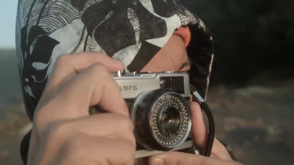 An Adult Man Taking A Picture Using His Olympus Trip 35 Camera In South Chile. Close-up