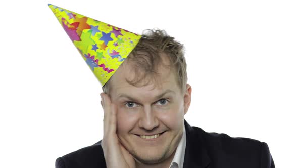 Drank Sleepy Young Businessman with Hangover in Festive Cap Has Hiccups