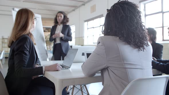 Businesswoman Making Presentation To Female Coworkers
