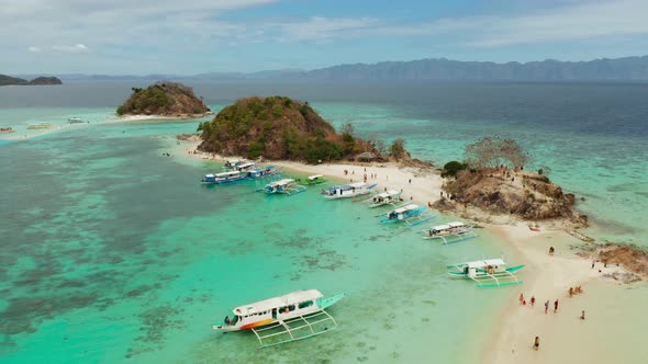 Small Torpic Island with a White Sandy Beach Top View