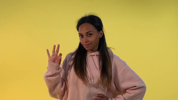 Portrait of Pretty African Woman Making Ok Hand Gesture