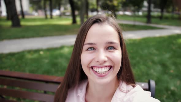 Young woman smiling while video conference with friends. Tourist making video calling.