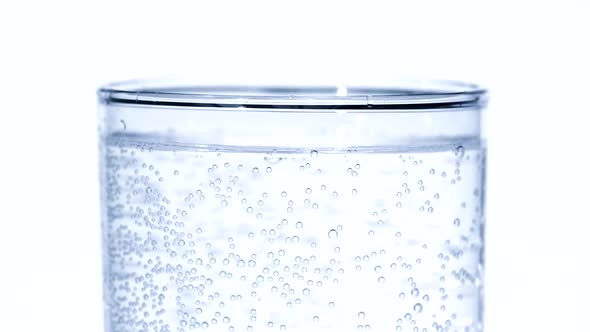 Sparkling Mineral Water in Glass Toned in Blue