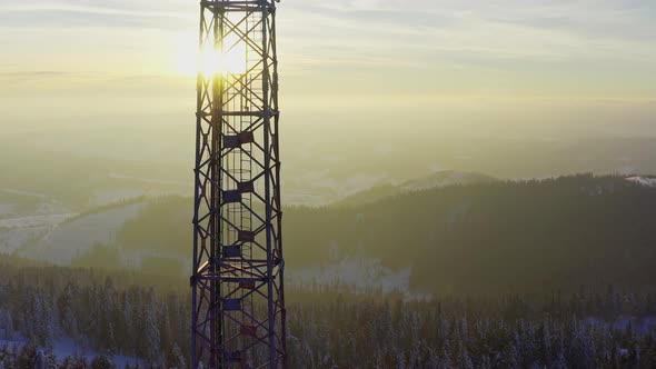 Flying Over Radio Communications Tower Mountain Snow Covered Winter Landscape