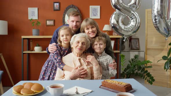 Portrait of Joyous Family at Grandmother Birthday Dinner