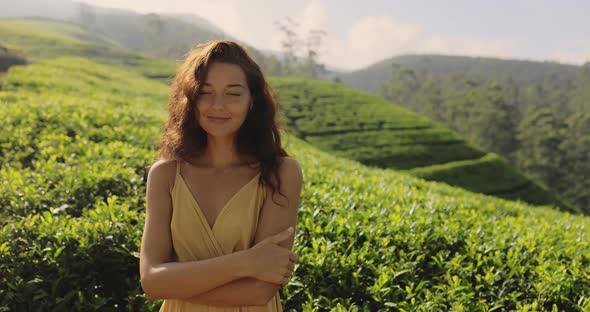 Crop View of Woman Traveler Portrait Against Tea Plantations Landscape Background