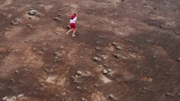 Tourist Walking on Rocky Mountain at Capelinhos Volcano Faial Island Azores