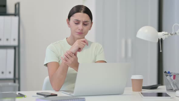 Young Latin Woman with Laptop Having Wrist Pain 