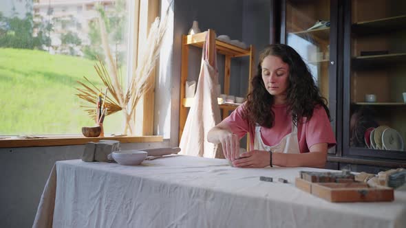 Craftswoman Creating Handmade Clay Products