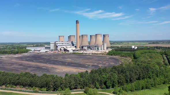 Aerial footage of the Eggborough Power station showing the eight cooling towers and chimneys in UK