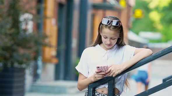 Adorable Fashion Little Girl Outdoors in European City