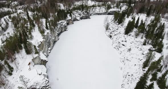 Vertical Shot Above the Frozen Marble Lake in Ruskeala Park in Karelia  Aerial
