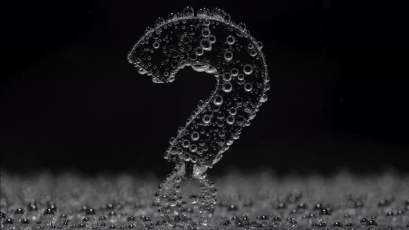 Question Mark Underwater in Bubbles of Oxygen on Black Background