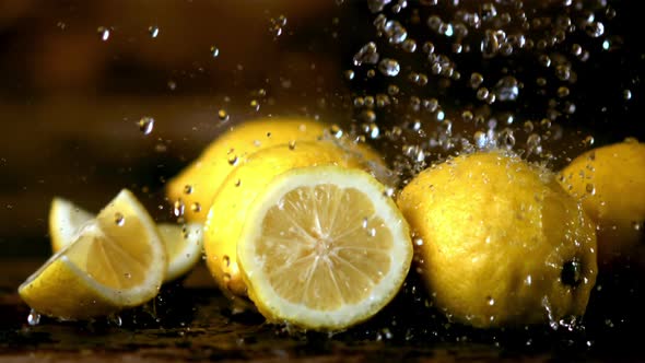 Super Slow Motion on the Lemons Drops Water with Splashes