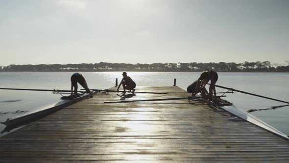 Female rowing team training on a river