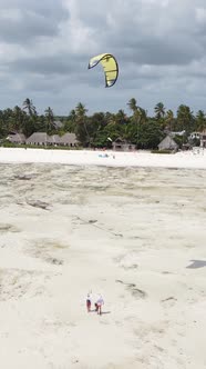 Vertical Video Kitesurfing Near the Shore of Zanzibar Tanzania