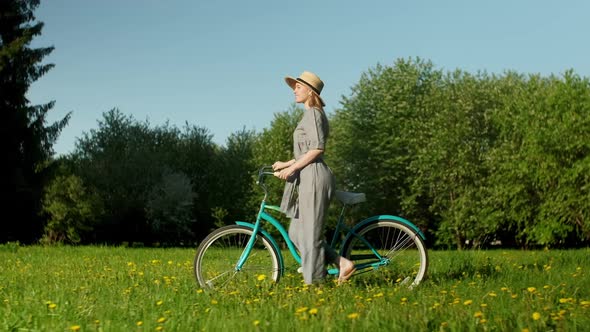 Cyclist Woman Walk With On Countryside Road At Summer Time